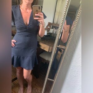 Ruffled Alexis mini dress in classic navy with pearly white polka dots